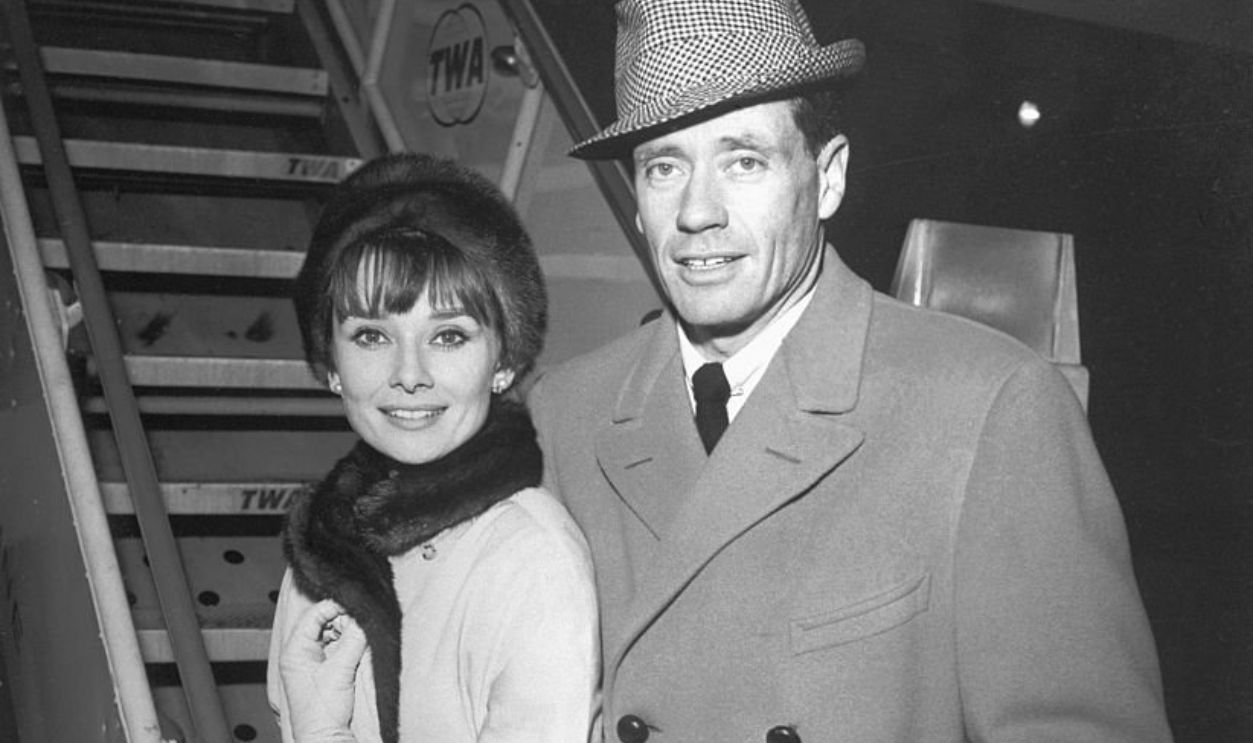 (Original Caption) Actress Audrey Hepburn and her actor-director husband Mel Ferrer are shown prior to boarding a TWA SuperJet for Los Angeles after jetting in from Rome. They will spend a week on the west coast while Audrey completes some additional filming on her new picture, Children's Hour. Ferrer meanwhile, will participate in script conferences for Nine Coaches Waiting, which he is directing for Columbia. They will return to Rome next week for the Christmas Holidays.