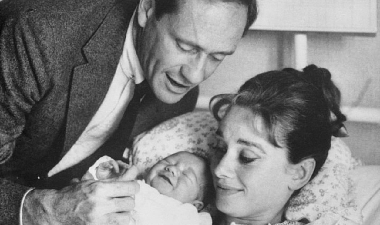 (Original Caption) Film actress Audrey Hepburn and her husband, actor Mel Ferrer, proudly show off their baby son, Sean, here July 19th. The nine pound youngster was born July 17th. He is the actress' first child.