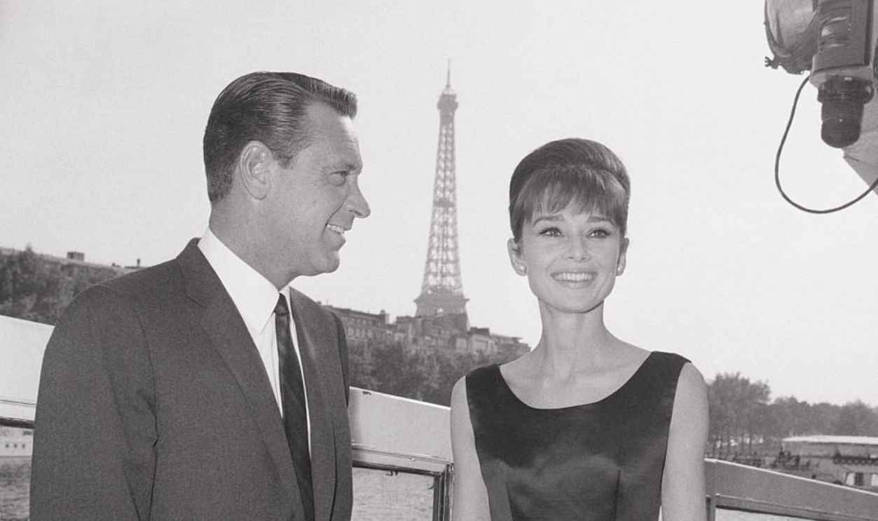 William Holden and Audrey Hepburn on a cruise along the Seine River, while in Paris to film Paris When it Sizzles.