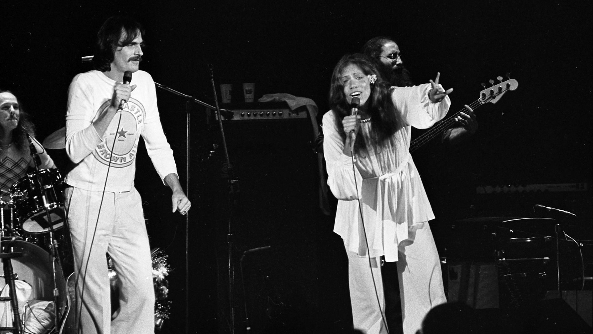 James Taylor and Carly Simon performing onstage in Los Angeles