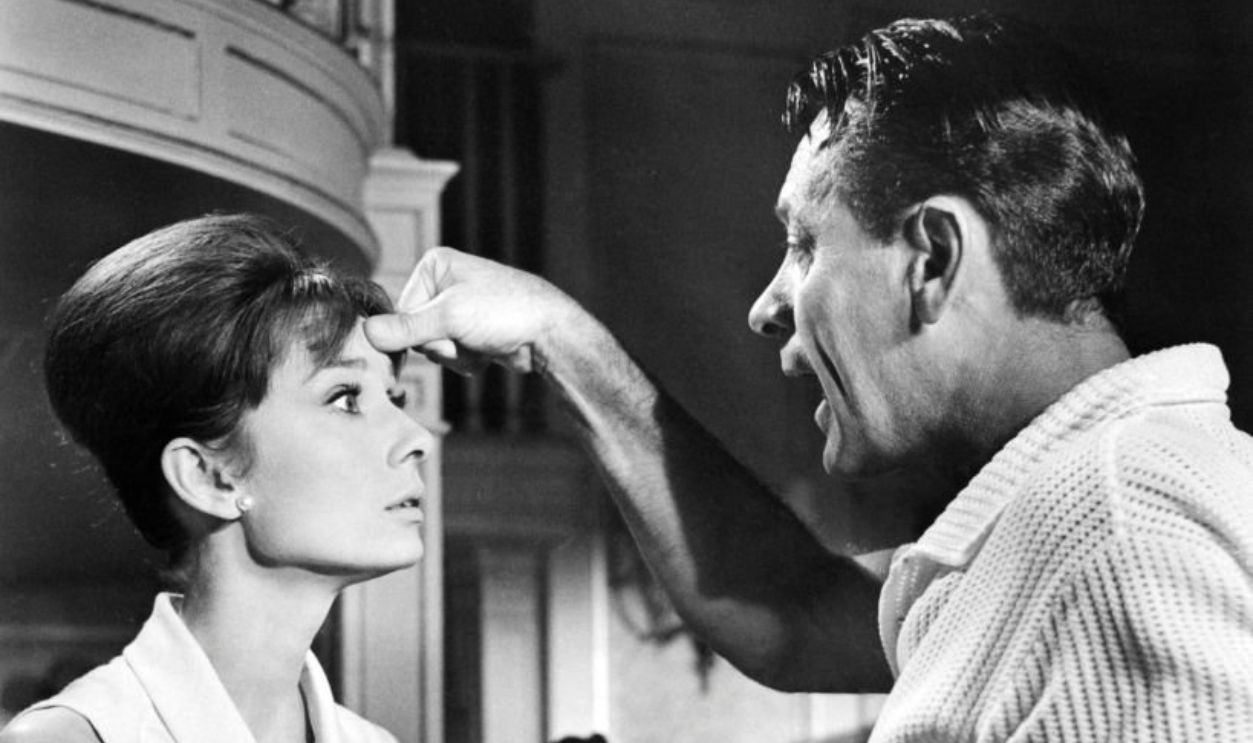 William Holden (1918 - 1981), as Richard Benson/Rick, and Audrey Hepburn (1929 - 1993) as Gabrielle Simpson/Gaby, in 'Paris When It Sizzles', directed by Richard Quine, 1964. 