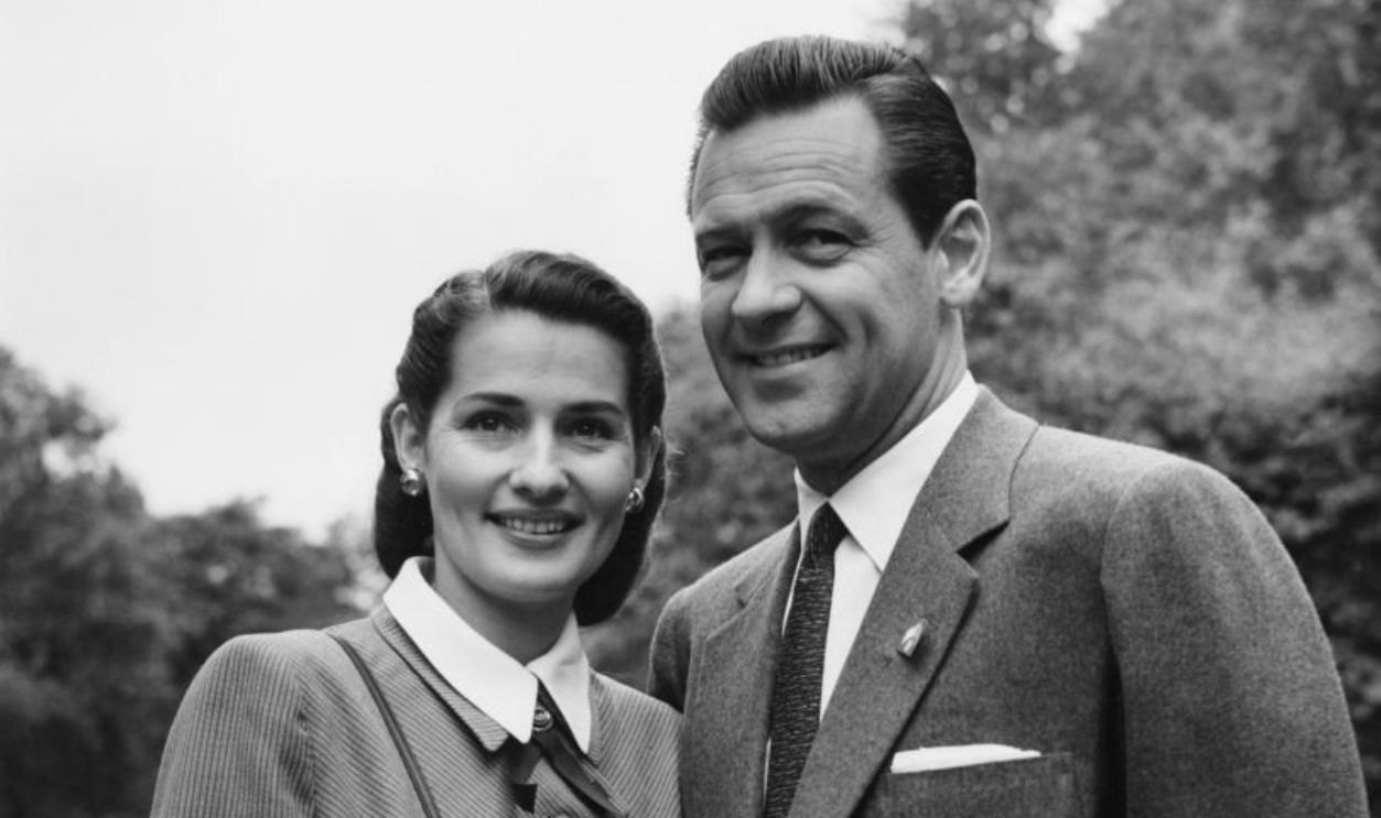 American actor William Holden (1918 - 1981) and his wife, actress Brenda Marshall (1915 - 1992) shortly after their arrival in London, 27th May 1952.