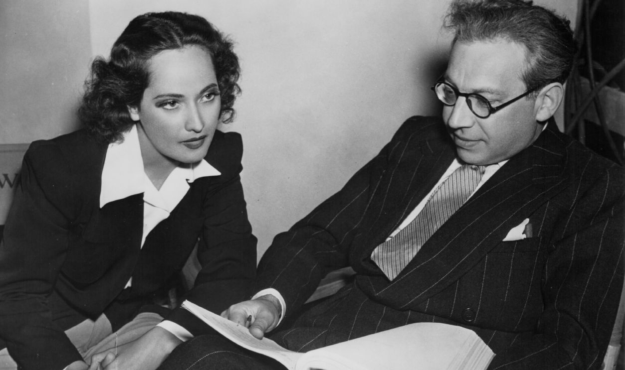 Actress Merle Oberon with her husband, film producer Alexander Korda, reading a script together
