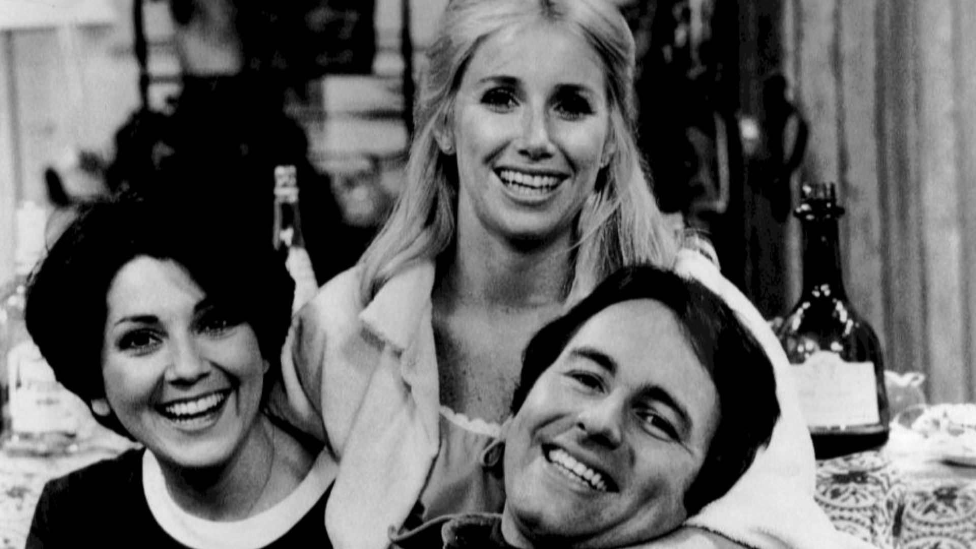 Publicity photo of the roommates from the television program Three's Company.  From left: Joyce DeWitt (Janet}, Suzanne Sommers (Chrissy), John Ritter (Jack).