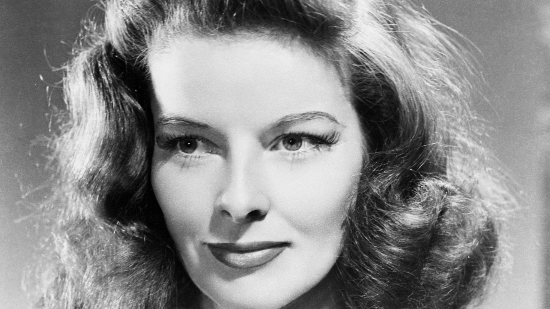 Studio publicity photograph of Katharine Hepburn. The full image, seen here, includes a stock number, the name of the studio, and the name of the subject - confirming that this was a promotional image.
Such images were taken by a studio photographer, and 