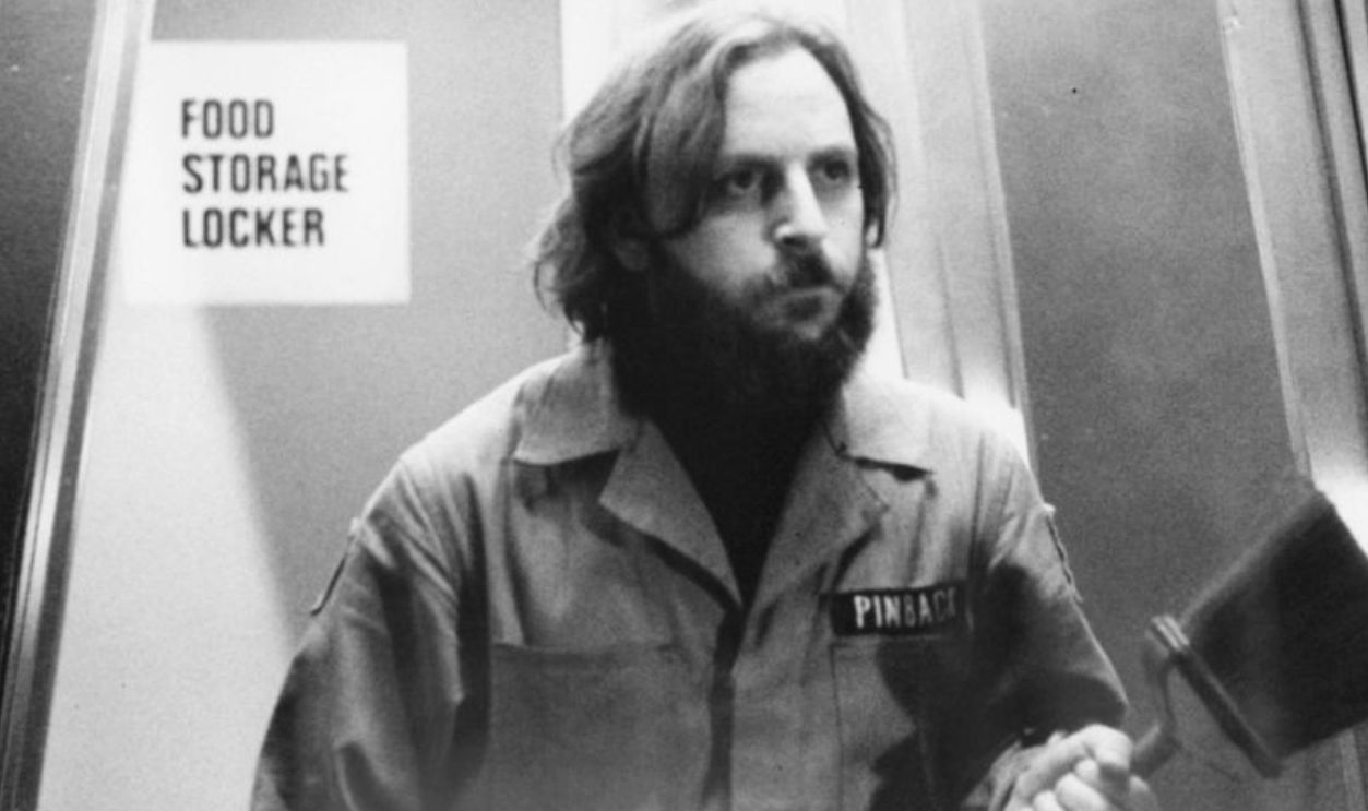 Dan O'Bannon coming from a food storage locker in a scene from the film 'Dark Star', 1974.