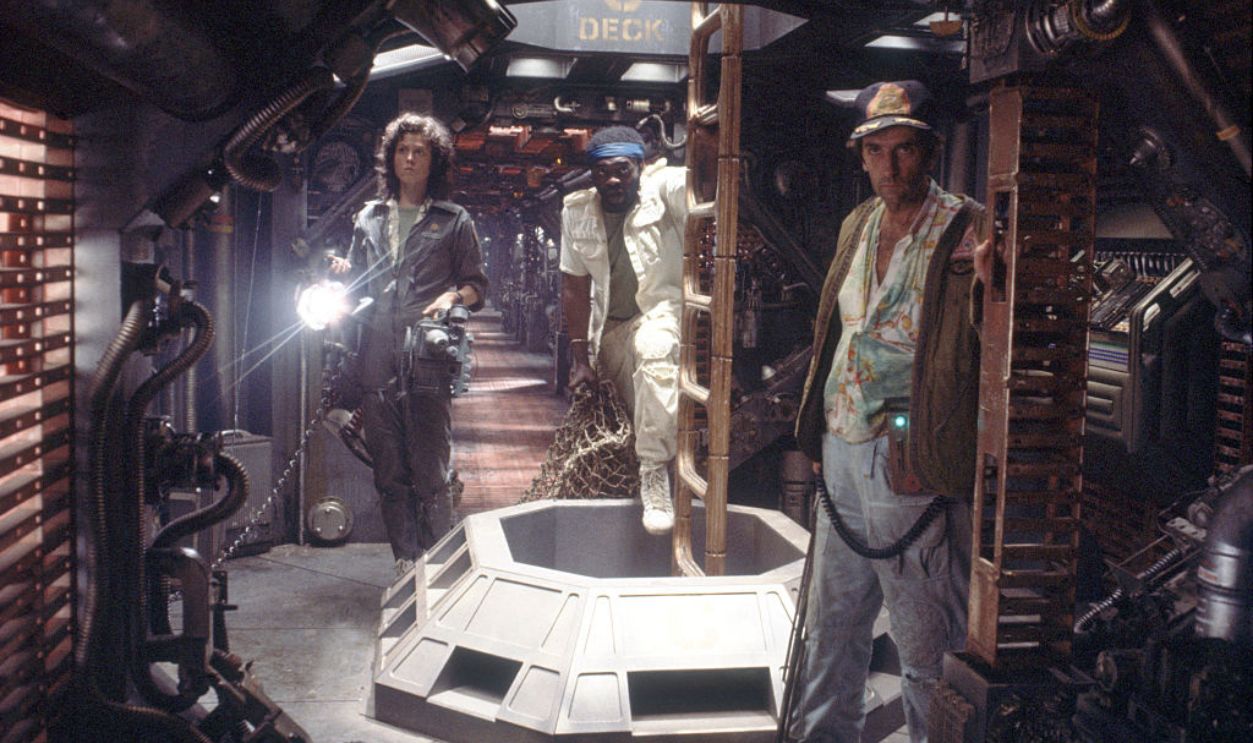 American actors Sigourney Weaver, Yaphet Kotto and Harry Dean Stanton on the set of Alien, directed by Ridley Scott. 