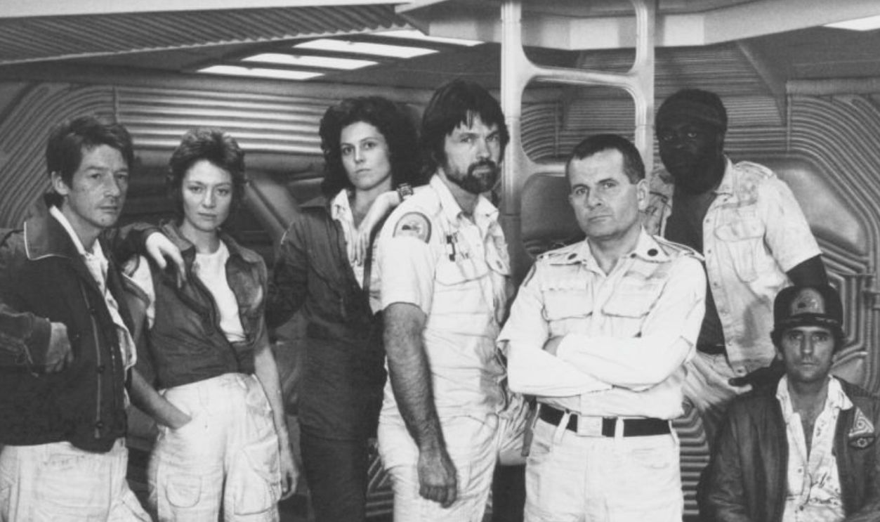 The crew of the Nostromo; actors John Hurt, Veronica Cartwright, Sigourney Weaver, Tom Skerritt, Ian Holm, Yaphet Kotto and Harry Dean Stanton, in a promotional shot for the movie 'Alien', 1979.