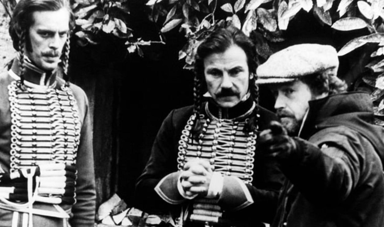 American actors Harvey Keitel and Keith Carradine with director Ridley Scott on the set of his movie The Duellists.  