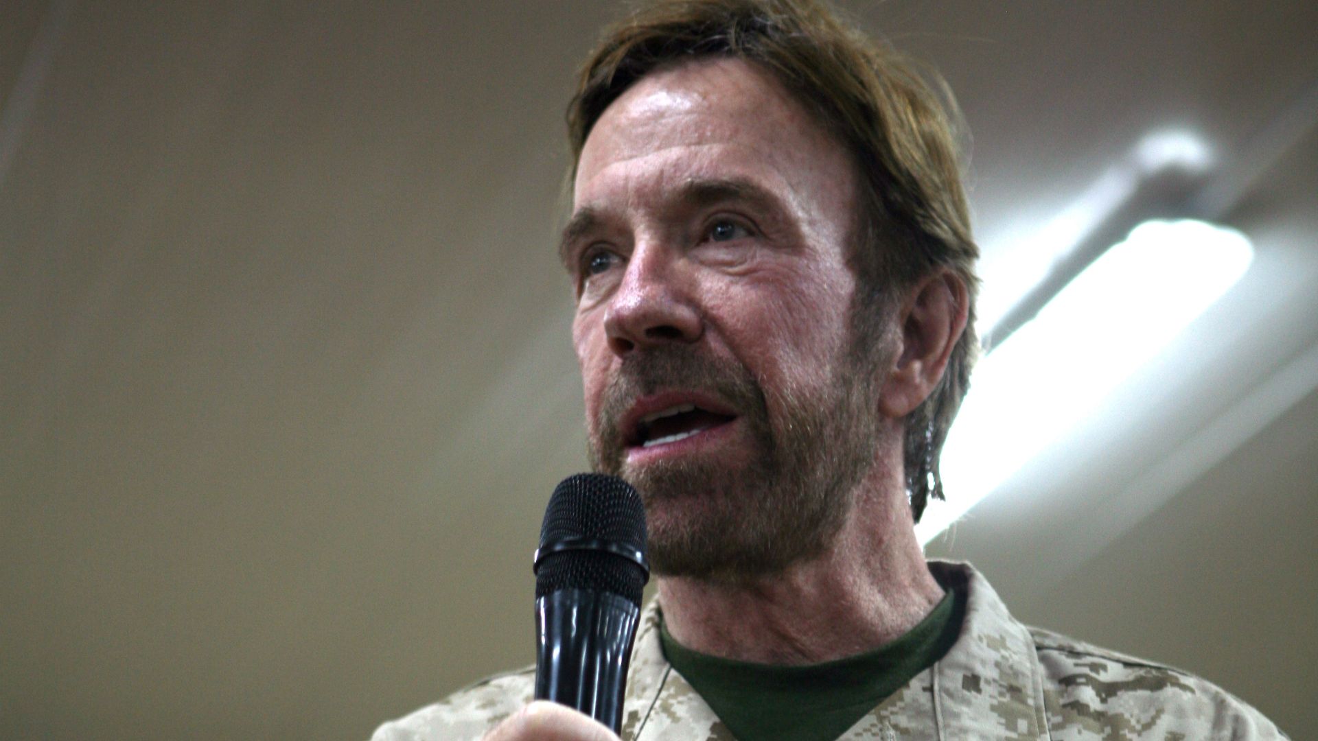 AL ASAD, Iraq - Actor and martial arts star Chuck Norris speaks to Al Asad service members during his meet and greet, Sept. 15. The event at Al Asad was one stop on Norris' tour of various bases in the Middle East to show his support for service members.