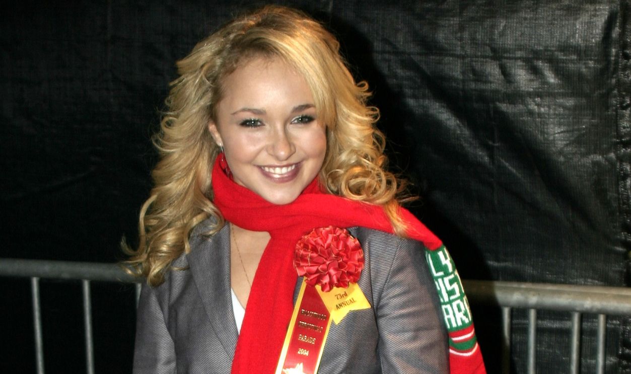 Hayden Panettiere wearing grey suit and white scarf looking a side and smiling - 2004