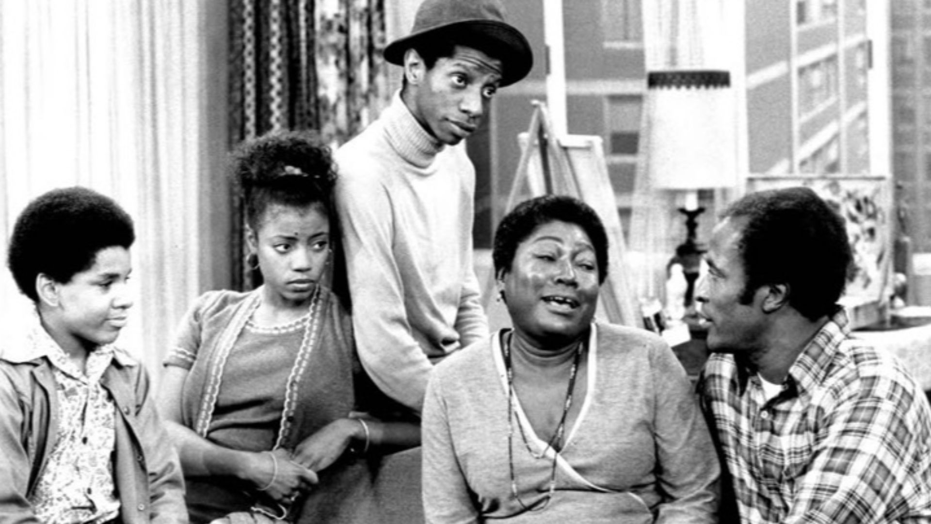 Photo of the Evans family from the television program Good Times.  From left: Ralph Carter (Michael), BernNadette Stanis (Thelma), Jimmie Walker (J.J.), Esther Rolle (Florida), John Amos (James).