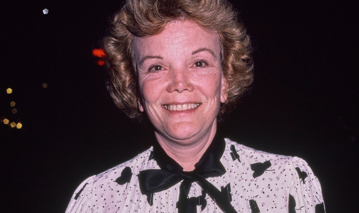 American actress, singer and dancer Nanette Fabray, wearing a black-and-white leaf pattern outfit with a black purse, United States, circa 1980.
