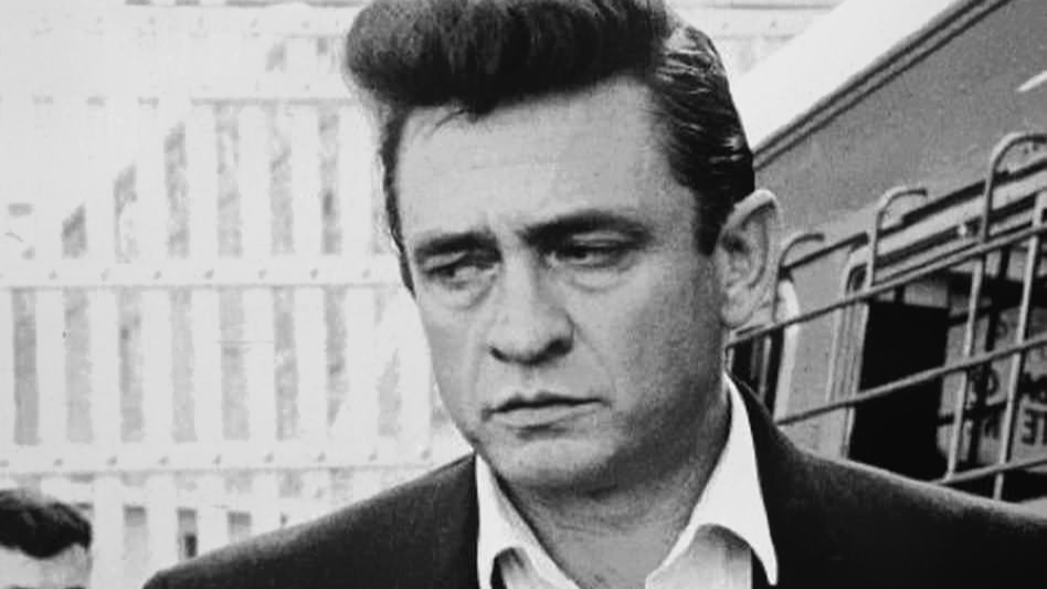 Country singer Johnny Cash in 1970 in black suit