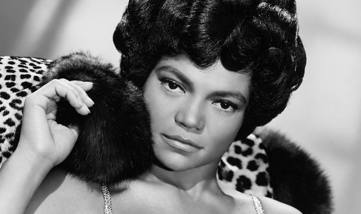American singer and actress Eartha Kitt decked in leopard skin and furs for her London stage show 'Talk of the Town', 9th September 1960