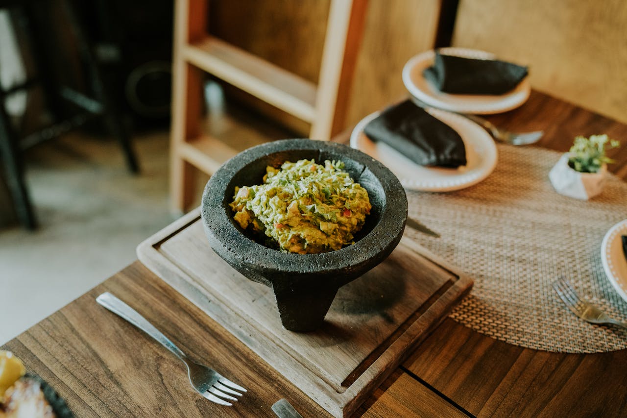Smashed Chickpea Salad in Black Bowl placed on a Table