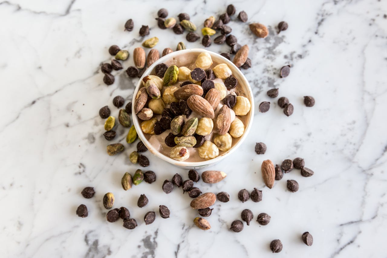 Close-up Photo of Nuts in Round White Bowl placed on a table