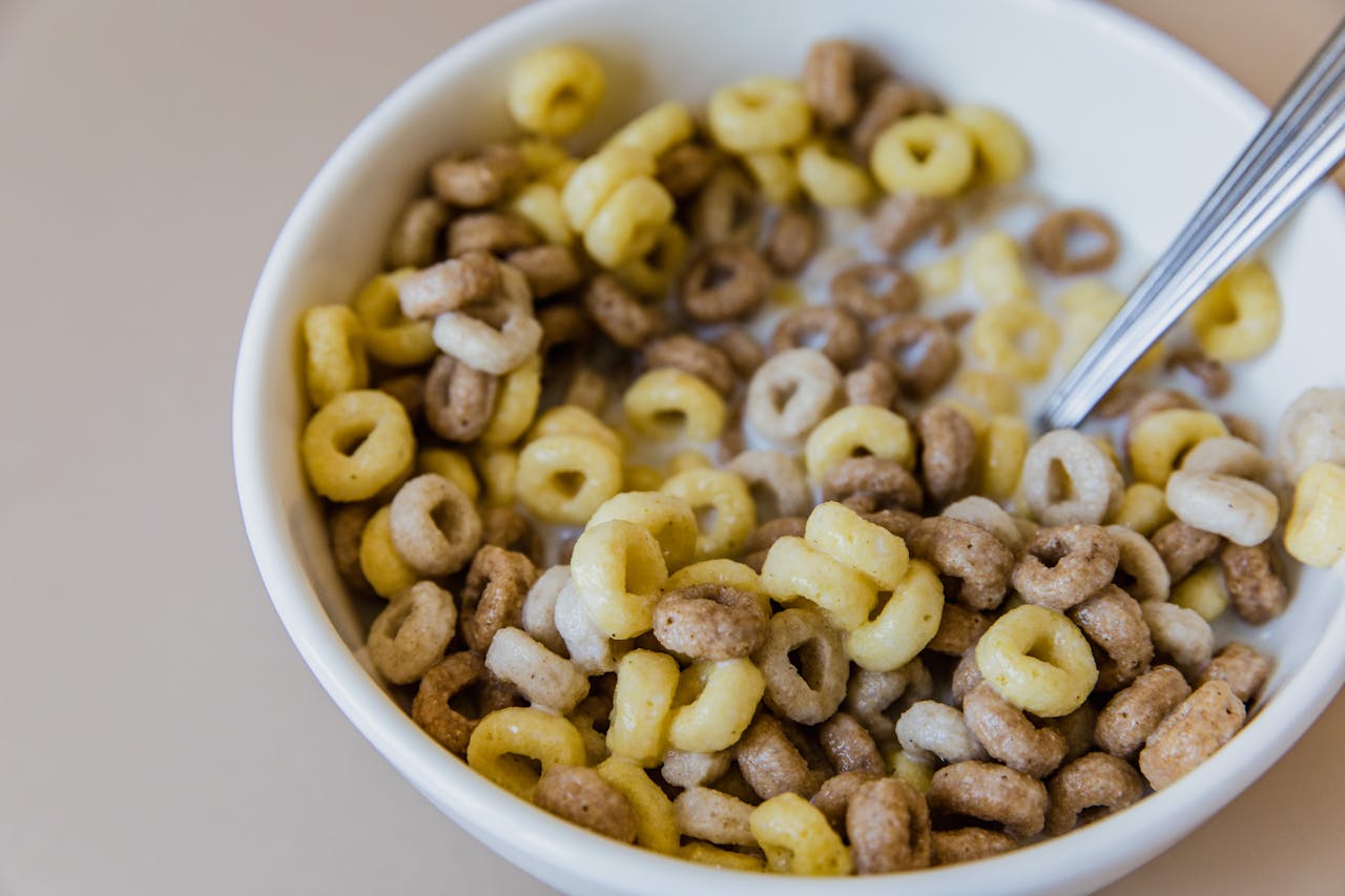 Close-up Photo of Cereal and Milk in a White Bowl