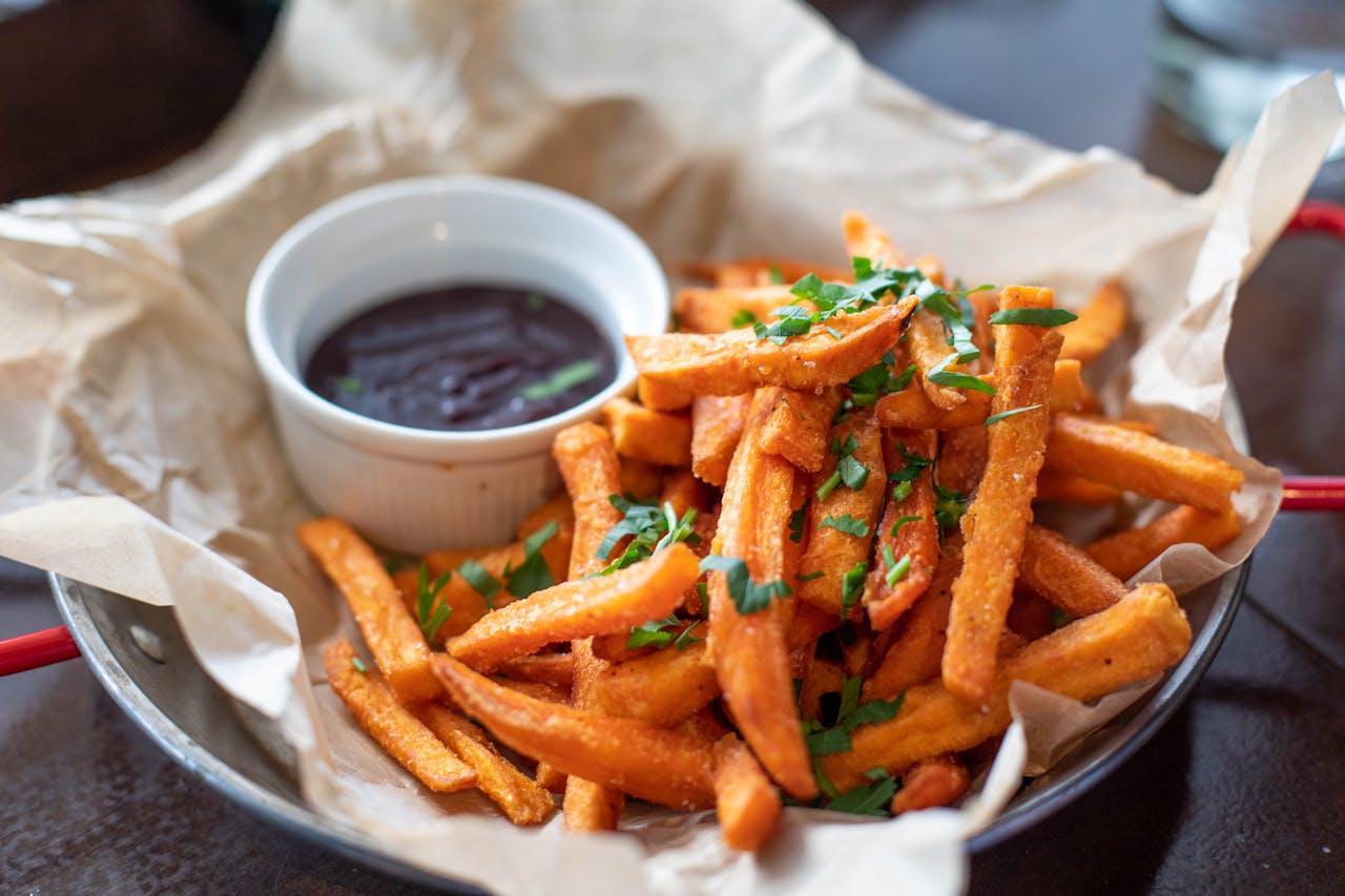 Close-up Photo of Sweet Potato Fries and Dipping Sauce in a plate