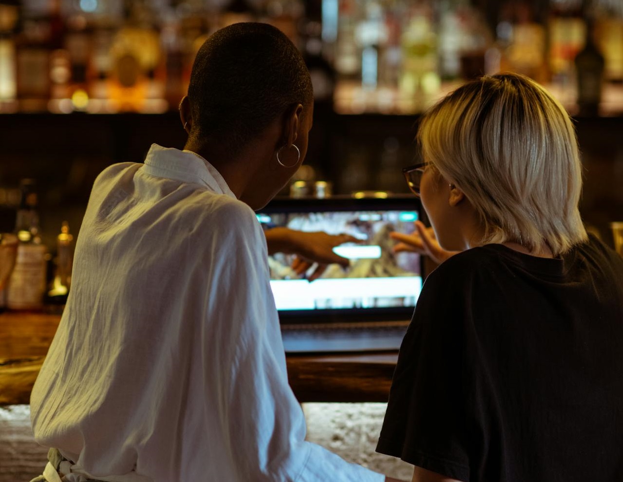 Coworking cafe workers using laptop