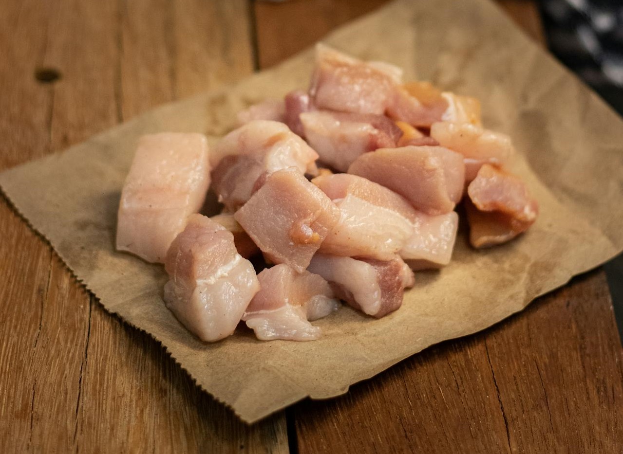 Slices of Pork Meat Over a Brown Paper