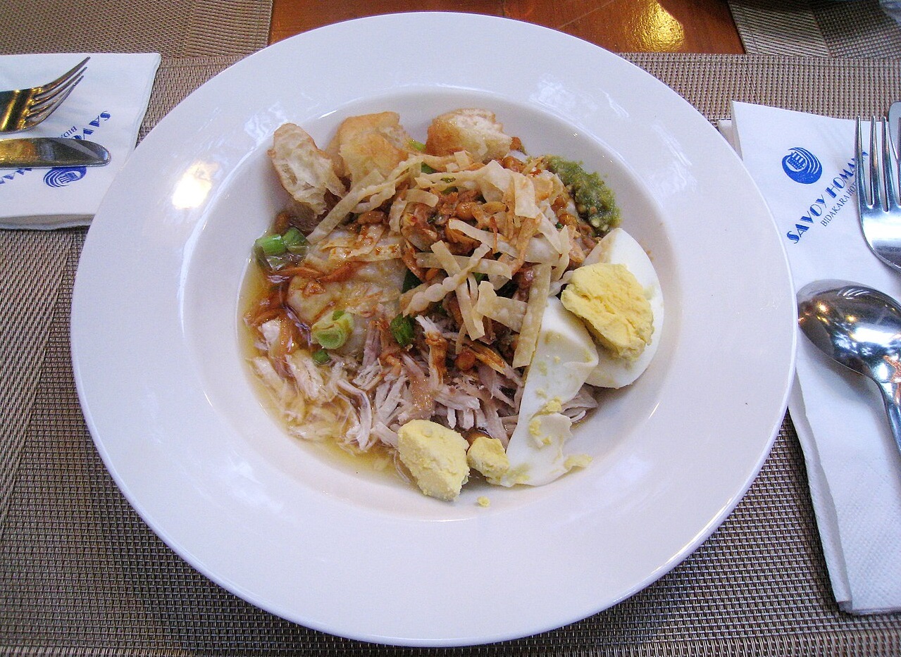 A Bubur Ayam (chicken rice congee) - street food.