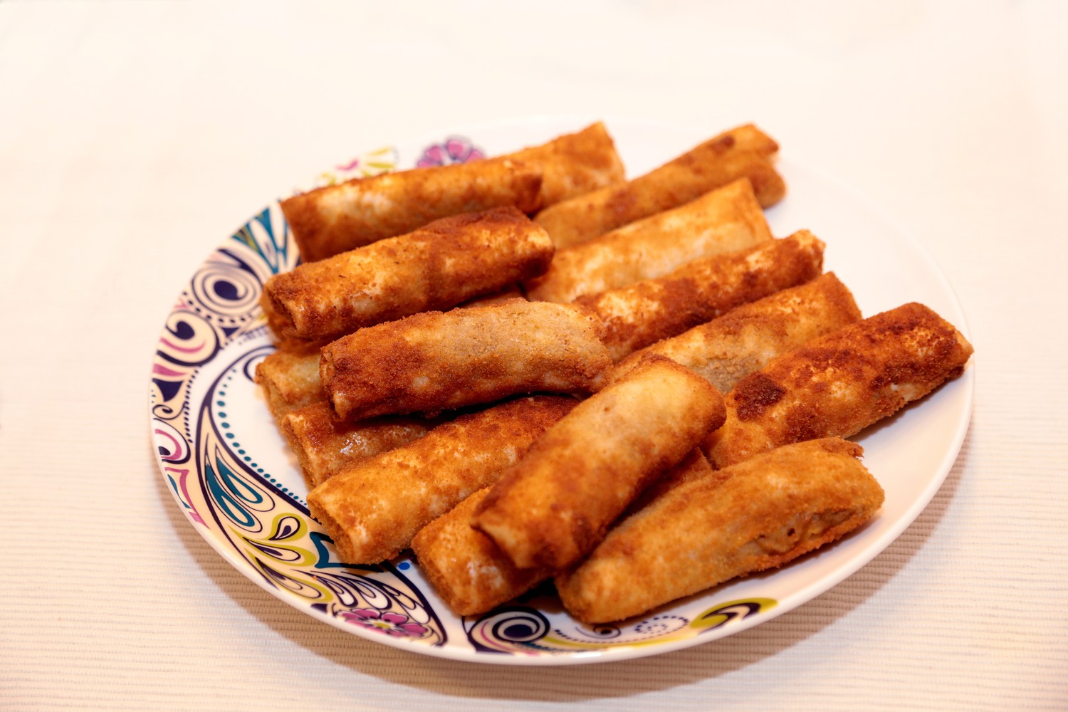 Chickenrolls on a plate.