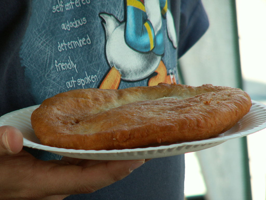 Person Holding a plate with a Native American frybread