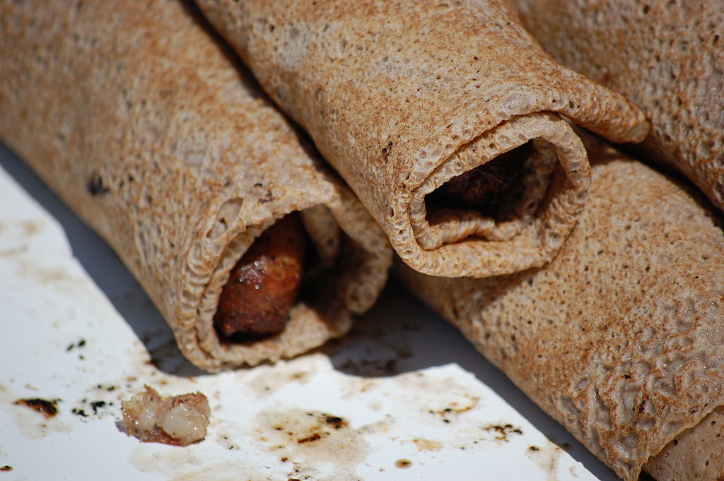Close-up Photo of Galette saucisse on a white plate