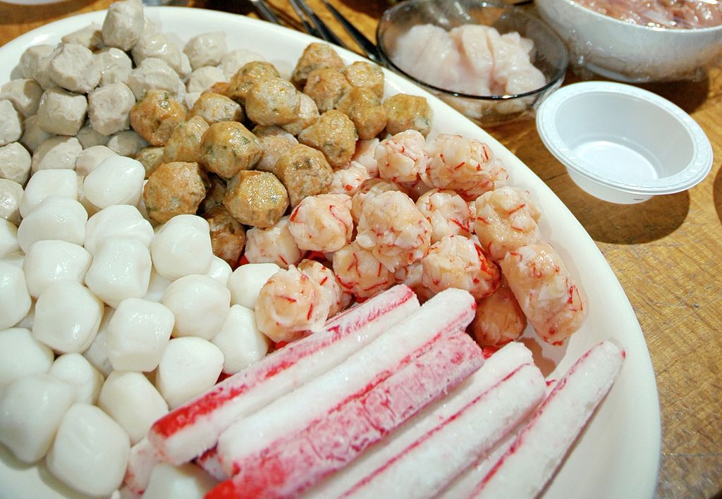 Close-up Photo of Fish balls on a white plate placed on a table