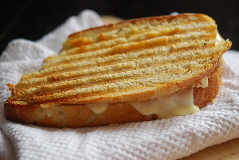 Close-up Photo of Grilled Cheese Sandwich placed on a wooden table
