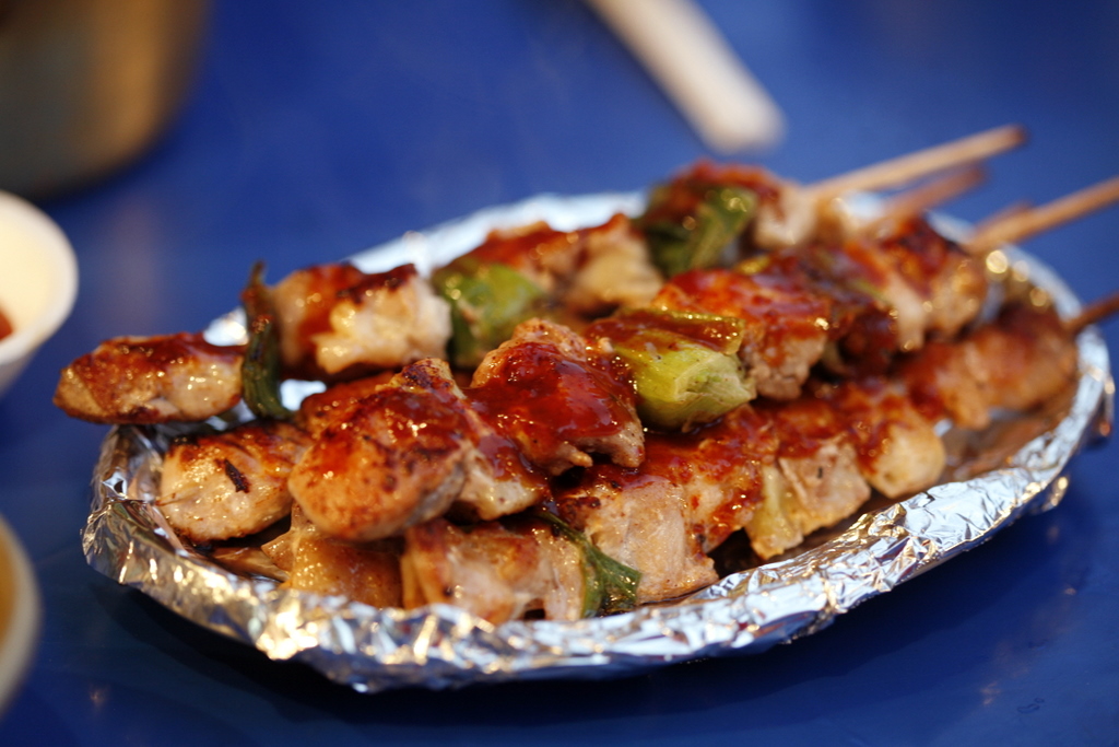 Close-up Photo of Dak-kkochi on a aluminum foil placed on a table