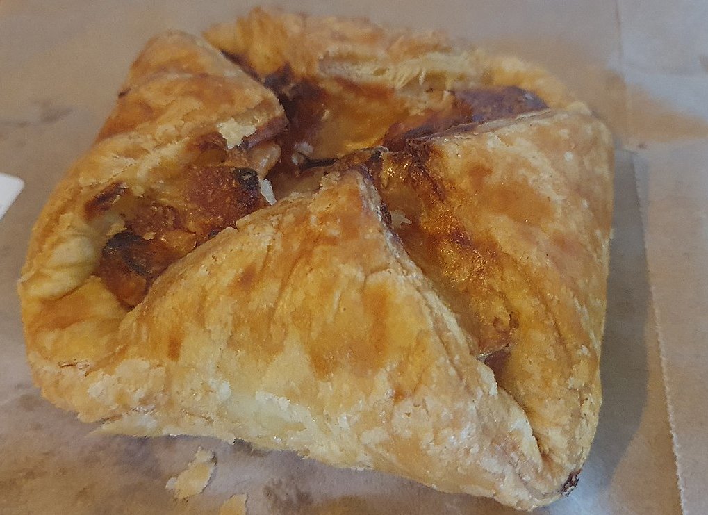 lose-up Photo of a jambon deli pastry placed on a table