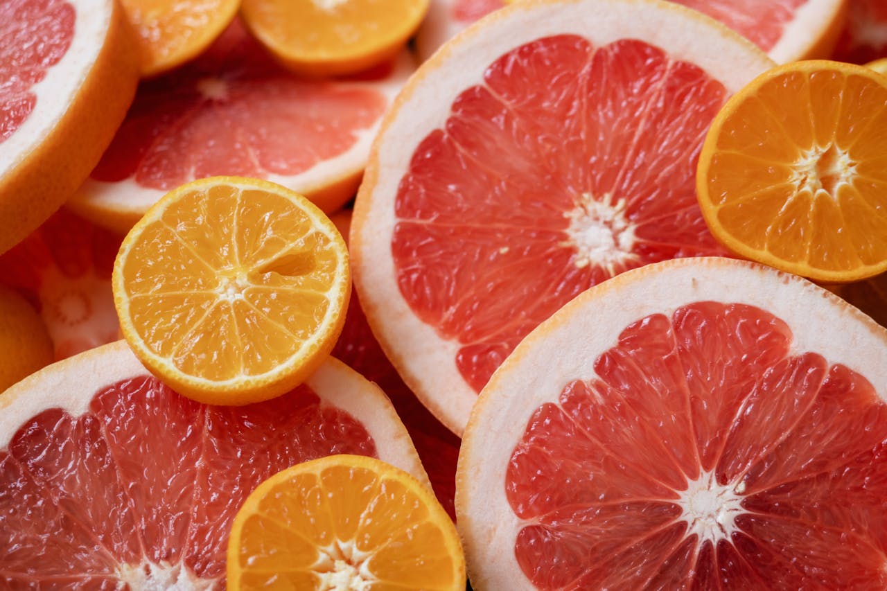 Photography of Sliced Oranges and Grapefruit