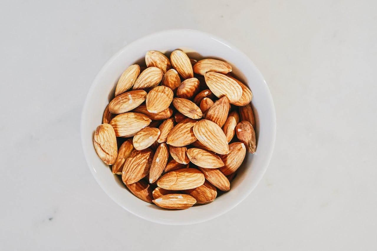 Brown Almond Nuts on White Bowl