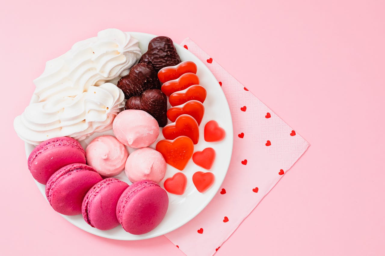 Delicious pink and red Cookies on a white plate