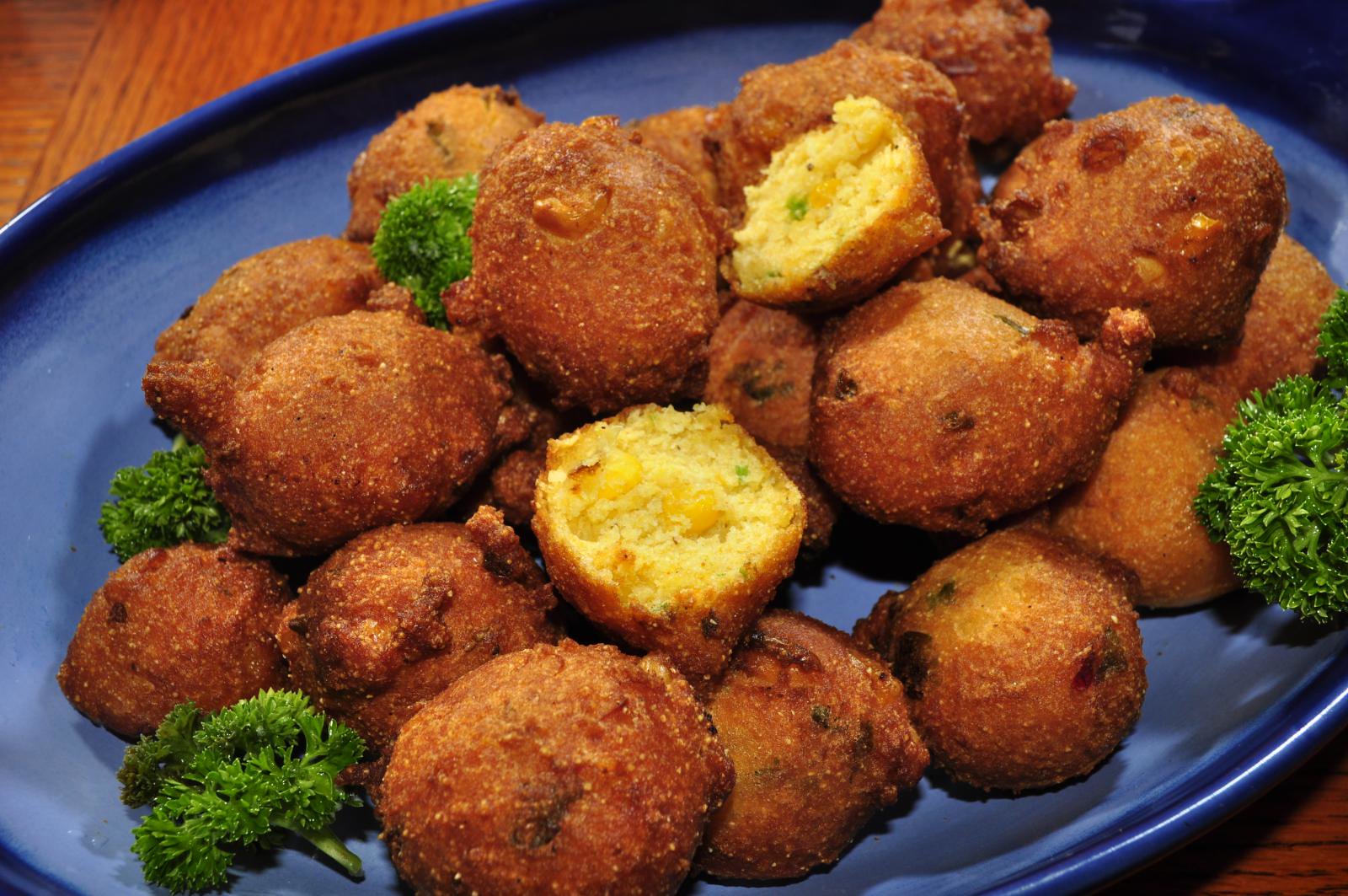 Hush puppies on a plate.