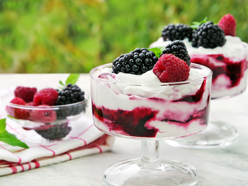 Berry fruit fool dessert in glass bowl.