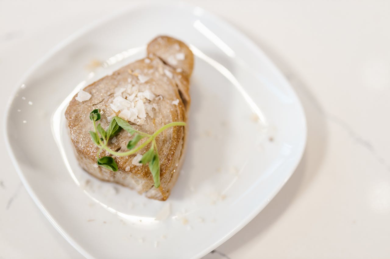 Tuna Fish Meat Served with Herbs on White Plate