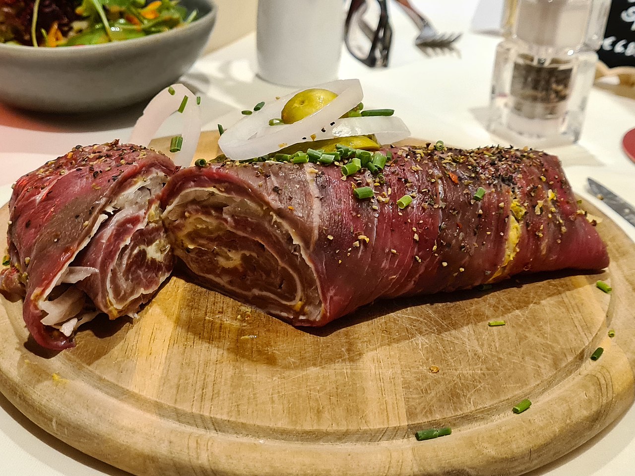 Raw meat with mustard before cooking.