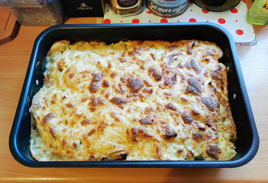 Close-up Photo of a Casserole in a Baking Tray placed on a wooden table