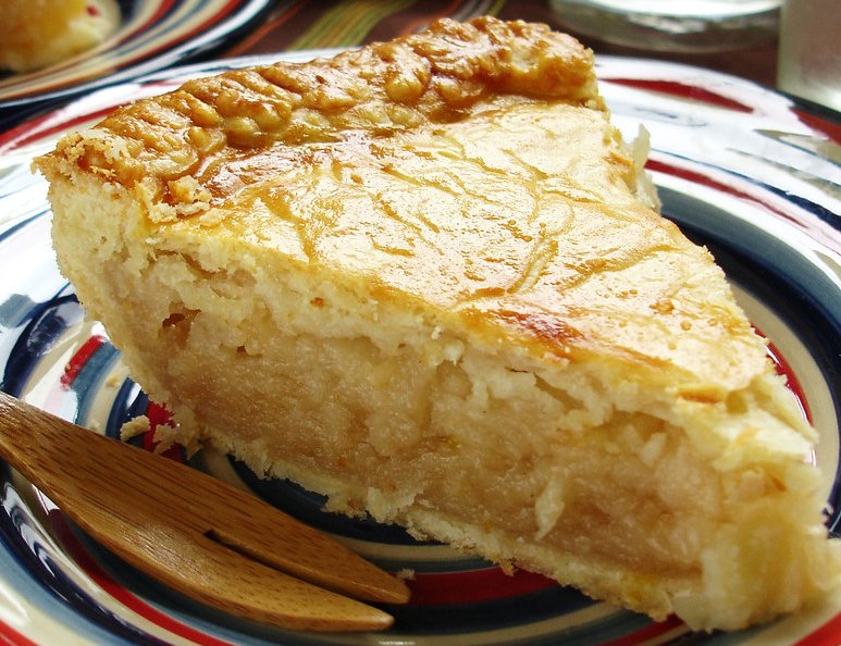 Close-up Photo of Mock Apple Pie in a colorful dish and a wooden fork