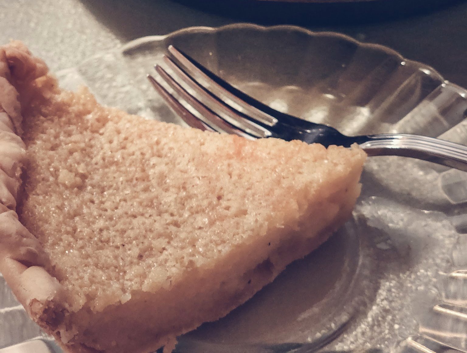 Close-up Photo of a vinegar pie in a crystal plate and fork