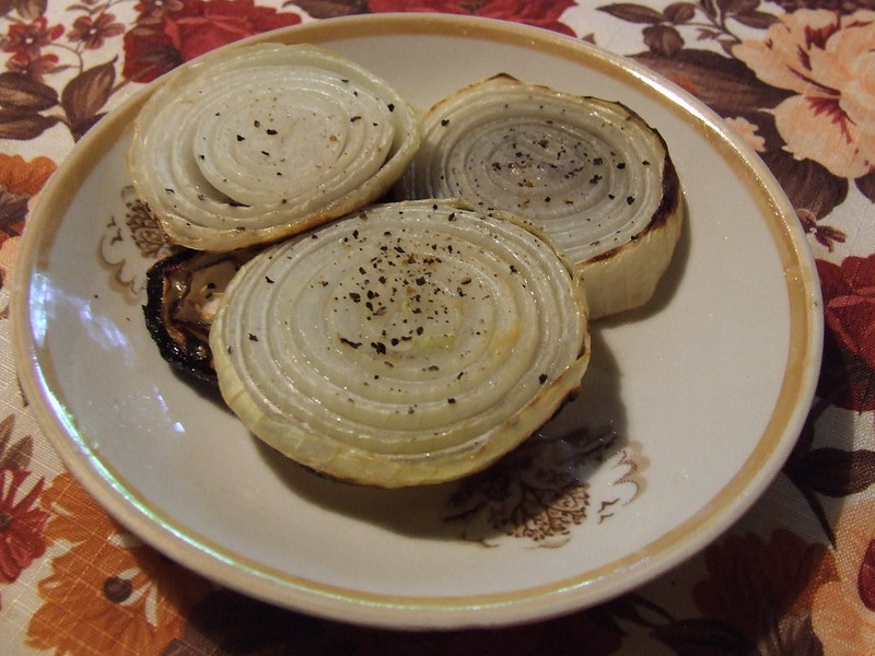 Close-up Photo of baked Onions in a white plate