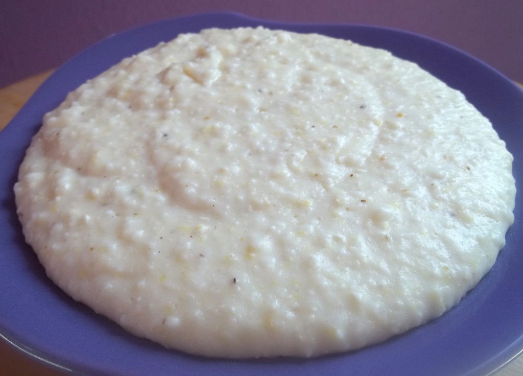 Close-up Photo of Corn meal porridge in a blue plate