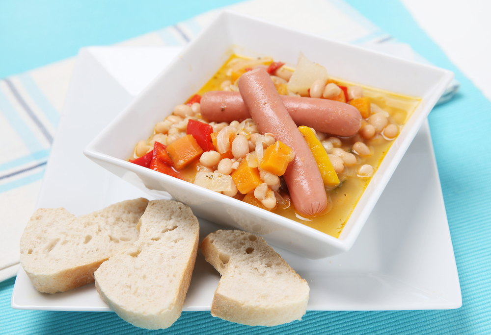 Delicious stew with white beans and hot-dog sausage and bread