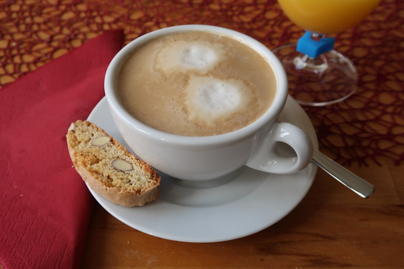 Close-up Photo of Cappuccino and biscotti placed on a table