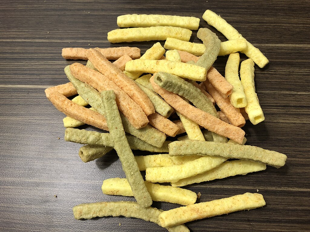 Close Up Photo of Veggie Straws placed on a wooden surface.