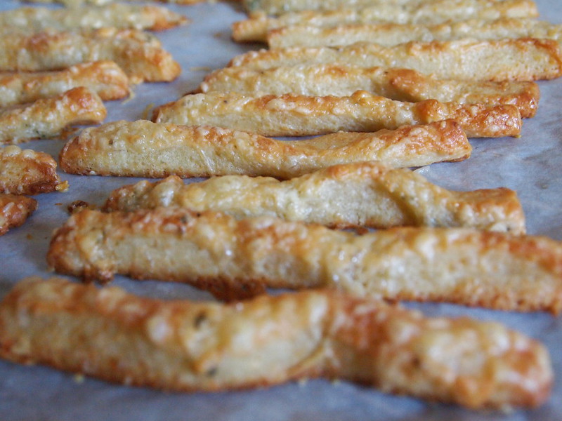 Close-up Photo of Cheese Sticks placed on a paper surface
