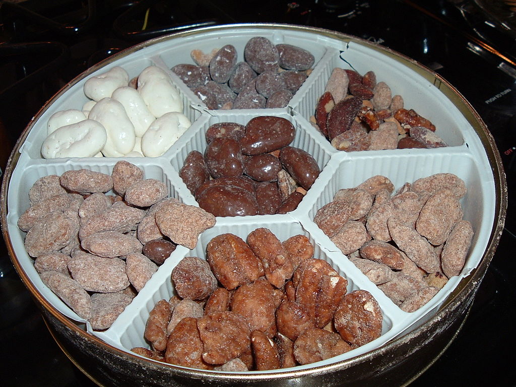 Close-up Photo of a metal container filled with Chocolate covered nuts